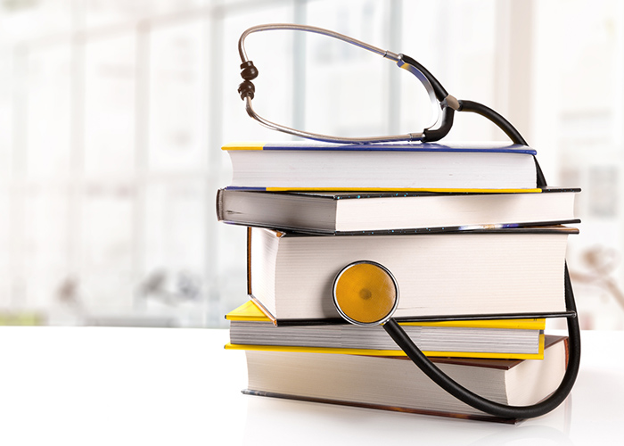 Stethoscope on top of books